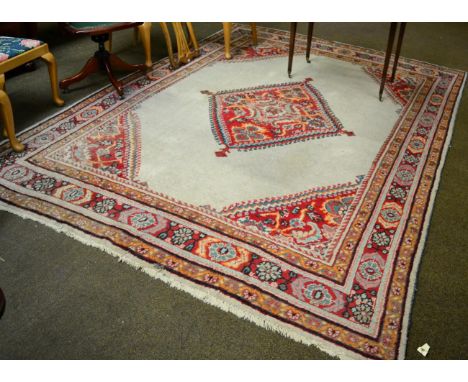 Mahal carpet, West Iran, the cream field centred by a stepped medallion framed by spandrels and multiple borders, 318cm by 23