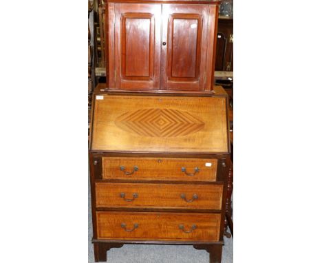 A bureau, a hanging corner cupboard, a standard lamp and a wine rack