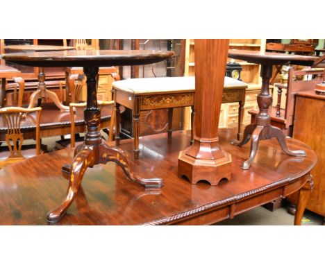 A 19th century French marquetry tilt top tripod table, together with a George III oak tilt top tripod table (2)