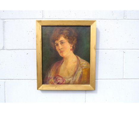 A late 19th, early 20th Century oil on canvas, portrait of a lady. Signed bottom left 'Ogilvie', possibly Frank Stanley Ogilv