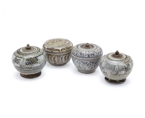 FOUR SAWANKHALOK BOXES AND COVERS
Circa 15th/16th C., all with underglaze decoration of either stylised foliage or lattice pa