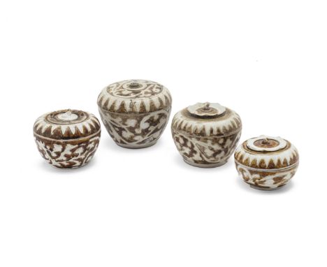 A GROUP OF FOUR SAWANKHALOK BOXES AND COVERS
Circa 15th C., three of persimmon type, with sepals to the cover, all decorated 