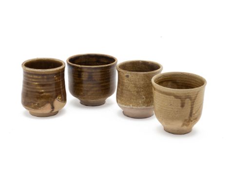 A GROUP OF FOUR POTTERY BEAKERS
With similar olive green glaze stopping before the unglazed foot
Tallest item 8cm high
Condit