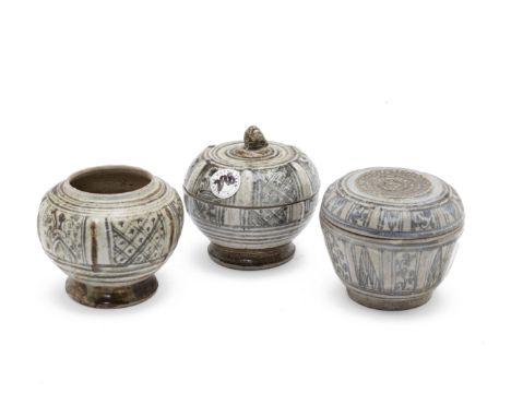 TWO SAWANKHALOK BOXES AND A JAR
Circa 15th/16th C., with panels of alternating foliate decoration
Tallest item 12cm high
Cond