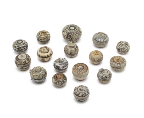 A GROUP OF MINIATURE SOUTHEAST ASIAN BOXES
Mostly Sawankhalok, circa 15th/16th C., with various decoration
Largest item 5cm d