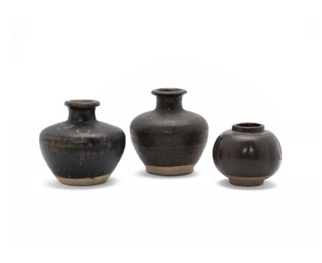 THREE SOUTHEAST ASIAN BROWN GLAZED JARS
Possibly Khmer, two with short necks and one spherical example
Largest item 11cm high