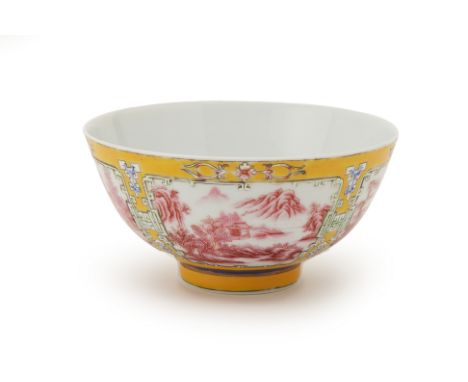 A YELLOW GROUND FAMILLE ROSE PORCELAIN BOWL
Decorated with landscape panels within archaic scroll borders, bears Yongzheng si