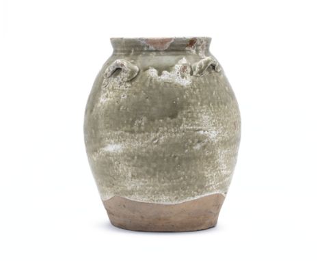 A GREEN GLAZED STORAGE JAR
Possibly Guandong Tang Dynasty, with four lug handles to the shoulder, the glaze stopping short of
