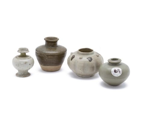 A GROUP OF FOUR ASIAN CERAMICS Comprising: a celadon jarlet, a squat spherical jar with lobed body and four prunts to the sho