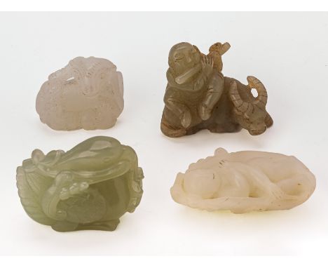 A GROUP OF FOUR JADE CARVINGS
Comprising: a boy riding an ox playing the flute; a duck holding a lotus; a ram; and a figure l