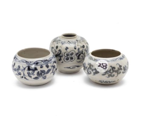THREE VIETNAMESE BLUE AND WHITE SPHERICAL JARS
Probably circa 15th/16th C., decorated with bands of scrolling foliage, the la