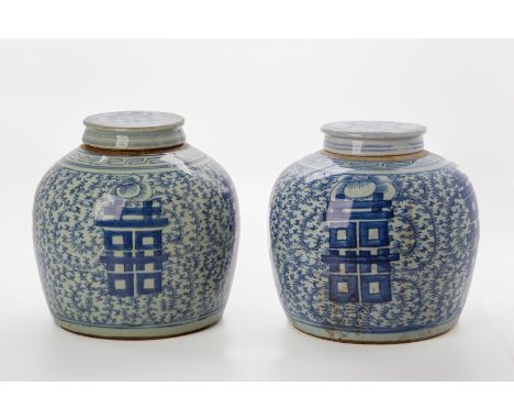 TWO SIMILAR BLUE AND WHITE GINGER JARS AND COVERS
With typical decoration of double happiness characters within scrolling vin