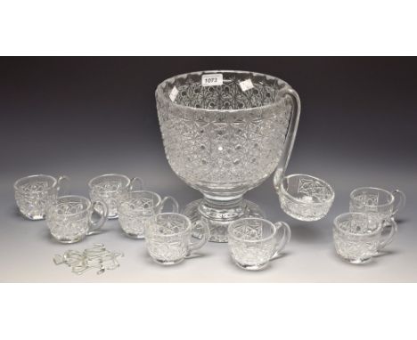 A 20th century hobnail and star cut punch bowl, ladle and eight mugs, 25cm high, mid 20th century 