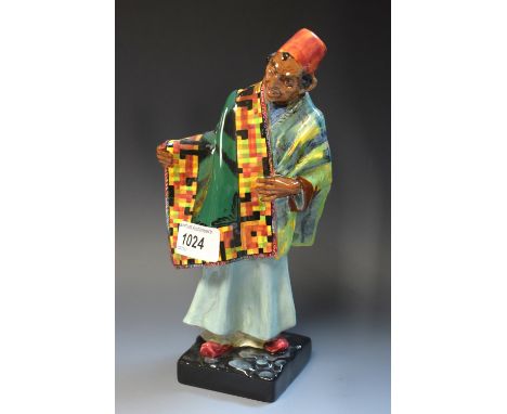 A Royal Doulton figure, The Carpet Seller HN1464