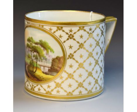 A 19th century Spode mug, painted with landscape within an oval, the ground with gilt husk trellis, angular handle, 10cm hihg