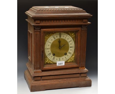 A 19th century Lenzkirch oak cased mantel clock, silvered dial, gilt brass spandrels, architectural oak case, striking moveme