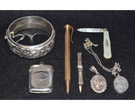 A silver vesta case, hallmarked; a silver and mother of pearl pen knife; silver toothpick (faults); silver bangle; 14ct rolle
