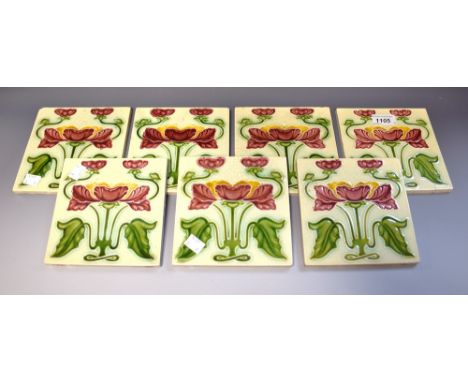 A set of seven Victorian Art Nouveau tiles, stylised orchids (7) 