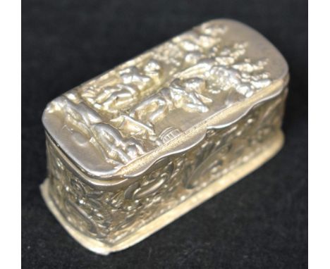 A Victorian silver rounded rectangular snuff box, embossed in the Dutch taste with musicians, flowerheads and leafy scrolls, 