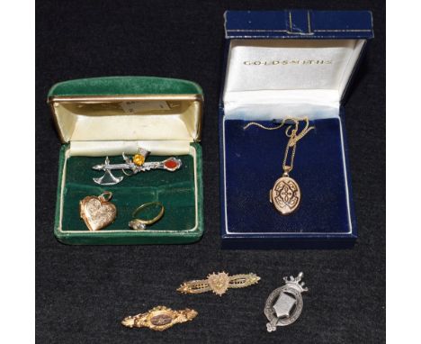 Jewellery - a 9ct gold mourning brooch, set with diamond chip; 9ct gold celtic design locket and chain; Scottish brooch set w