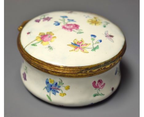 An 18th century gilt-metal mounted enamel circular table snuff box, the hinged cover and slightly ogee base decorated in the 