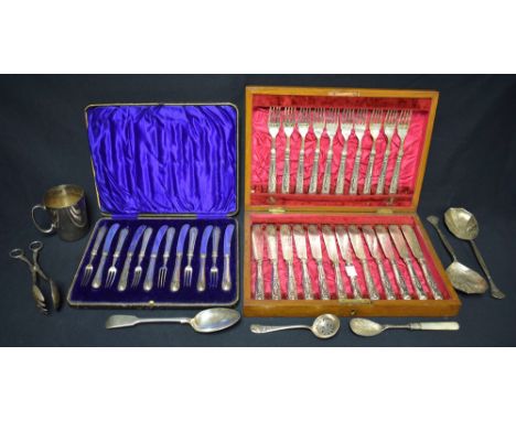 A set of six silver hafted fruit knives and forks, cased, Sheffield 1909;  a set of eight silver hafted fish knives and forks