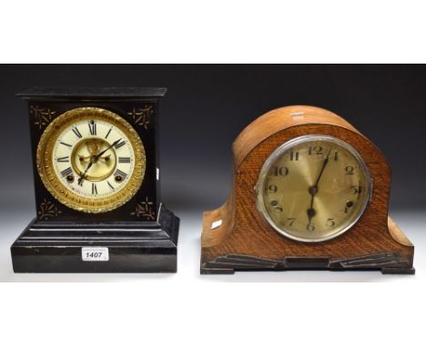Black plate mantel clock, Roman numerals; an oak cased mantel clock 
