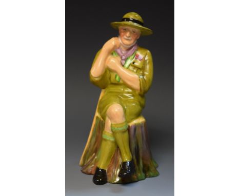 A Tuscan China porcelain model, Lord Baden Powell, seated in Scout uniform, printed makers