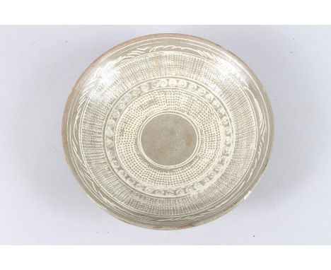 A KOREAN POTTERY CIRCULAR SHALLOW BOWL. 9ins diameter.