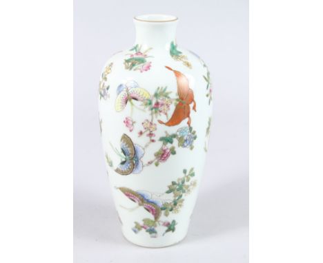 A CHINESE PORCELAIN VASE, painted with butterflies and flowers, red seal mask to base. 25cms high.