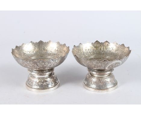 TWO THAI WHITE METAL FOOTED BOWLS. 5ins diameter.