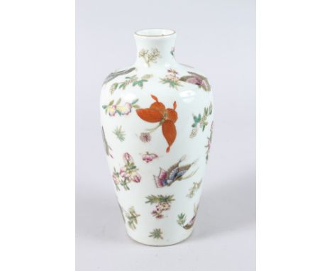 A CHINESE PORCELAIN VASE, painted with butterflies and flowers, red seal mask to base. 25cms high.