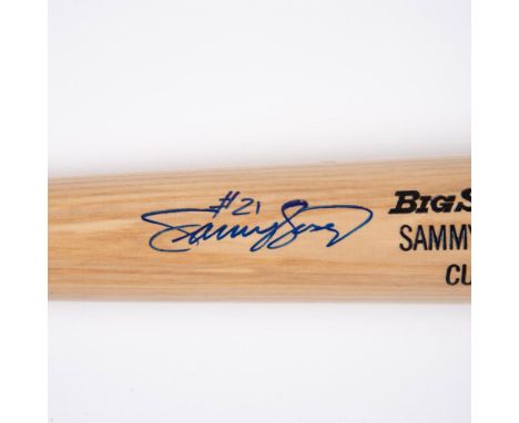 A Rawlings Big Stick Bat engraved with Sammy Sosa's name and Cubs underneath. It was personally signed by Sammy Sosa #21 in b