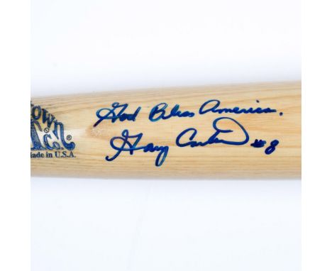 This Cooperstown commemorative bat features an engraved and painted American flag and is autographed by Hall of Famer Gary Ca