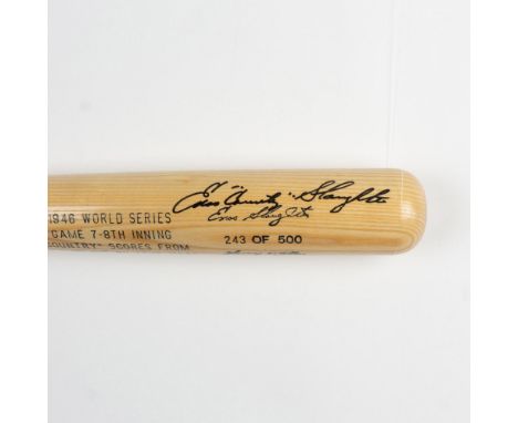 A natural wood bat with elegant black engravings signed by Enos Slaughter and Harry Walker. Louisville Slugger marked. Certif