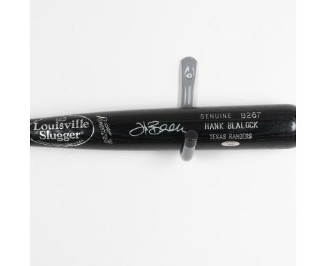This is a Genuine B267 Hank Blalock Name Model black LS bat also signed by Blalock. Certificate of Authenticity from Tristar 