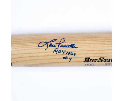 This is a natural wood-colored Rawlings Big Stick #232 Adirondack model bat, signed in blue by Lou Piniella, the 1969 Rookie 