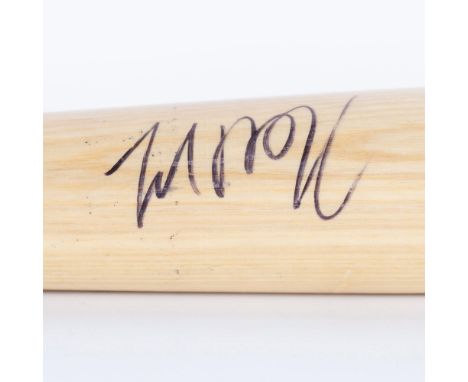 A natural-wood colored Rawlings Big Stick professional model bat personally signed by Hall of Famer Fred McGriff. Certificate