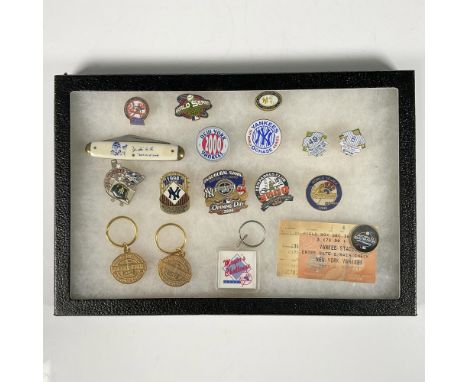 This grouping includes a Babe Ruth Sultan of Swat single-blade pocketknife, three key chains, a souvenir coin, a Yankee Stadi
