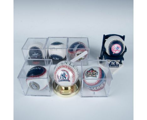 This collection includes a 2009 World Series ball, a ball commemorating the old Yankee Stadium from 1923-2008, a ball commemo