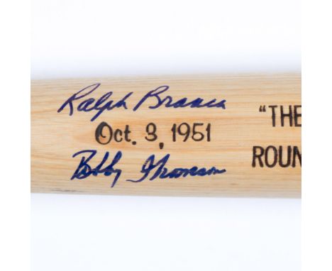 This is a Louisville Slugger commemorative bat signed in blue by Bobby Thomson and Ralph Branca. In baseball, the Shot Heard 