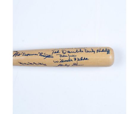 This natural wood-colored Hillerich and Bradsby Co. Louisville Slugger bat is signed by several players from the league known