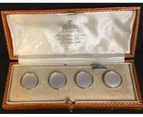 A set of four gentleman's gold and mother-of-pearl dress buttons, each marked 18ct and 9ct, cased 
