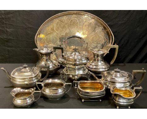 A large 19th century plated oval gallery tray, 57.5cm wide; a Mappin &amp; Webb plated four piece tea service; another simila