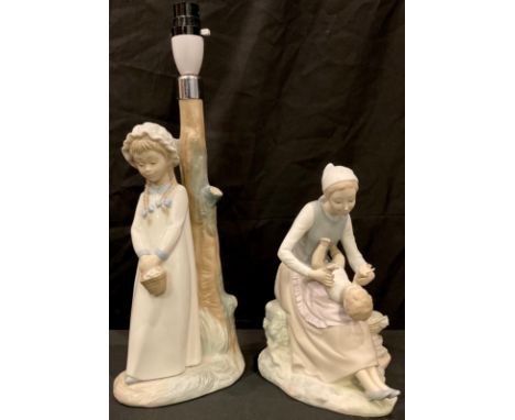 A Nao figure group, mother and child, 24cm, printed mark; a Nao Spanish porcelain figural table lamp, as a girl in a bonnet w