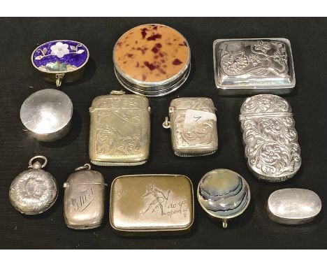 A silver vesta case, Birmingham 1919; another, 1899; a silver pill box, mark 925; another, Birmingham 1900; a silver and faux