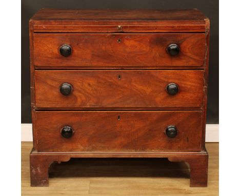 A George III provincial mahogany bachelor’s chest, crossbanded caddy top above a slide and three long graduated drawers, skir