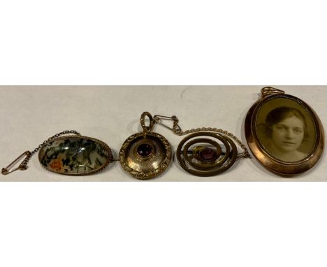 A late 19th century gold mounted oval moss agate brooch with safety chain, 4cm wide, unmarked; a Victorian gold plated circul