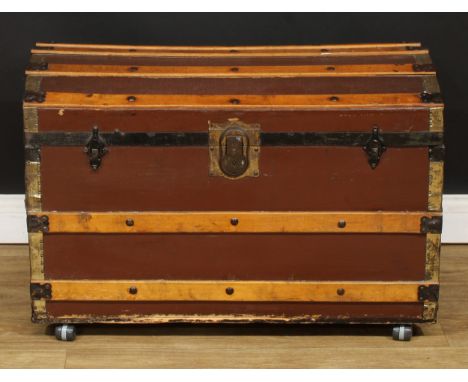A brass and hardwood mounted dome top travel or steamer trunk, 56cm high, 83cm wide, 47cm deep 
