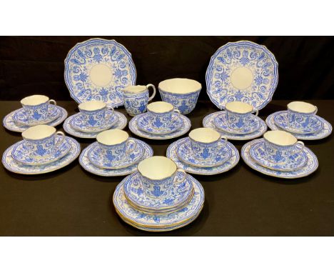 A Royal Crown Derby tea set, transfer printed in blue and white with birds perched amongst neoclassical swags, comprising ten